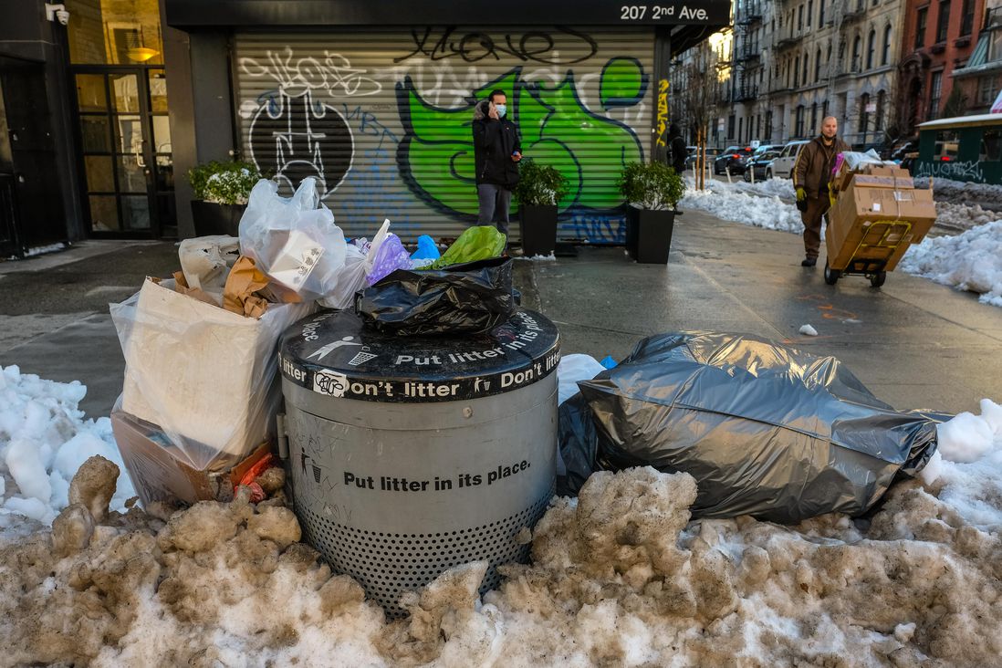 New Yorkers step over slush lagoons and frozen trash